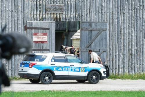 Winnipeg police and construction specialists at Fort Gibraltar, where several youths fell when a portion of an upper walkway collapsed Wednesday afternoon. (Mike Deal / Winnipeg Free Press)