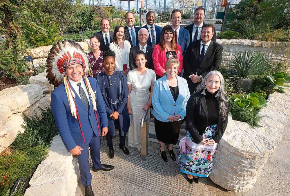 Manitoba Premier Wab Kinew, left, and his cabinet, from left, Tracy Schmidt, , Uzoma Asagwara, Ron Kostyshyn, Matt Wiebe, Malaya Marcelino, Nello Altomare, Jamie Moses, Bernadette Smith, Lisa Naylor, Adrien Sala, Ian Bushie, Glen Simard, and Nahanni Fontaine. THE CANADIAN PRESS/John Woods