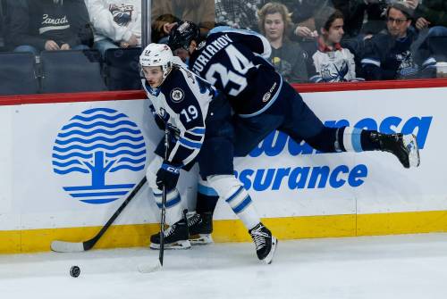 JOHN WOODS / WINNIPEG FREE PRESS files
                                Nikita Chibrikov (left) has 14 goals for the Manitoba Moose this season.