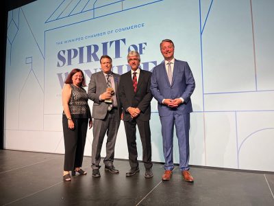 Kevin Sitka (third from the left), CEO at Assiniboine Credit Union, accepting a Chamber of Commerce Spirit of Winnipeg award.