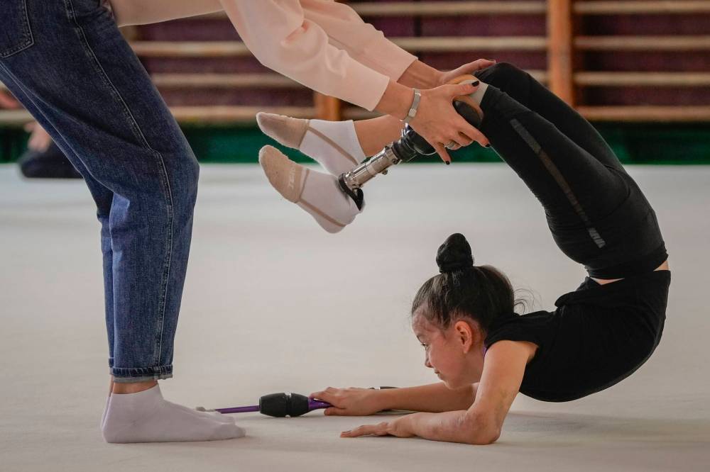 Efrem Lukatsky / The Associated Press
Oleksandra Paskal, an 8-year-old girl with a prosthetic leg, practices rhythmic gymnastics with other girls with coach Inga Kovalchuk in Chornomorsk, Odesa region, Ukraine.