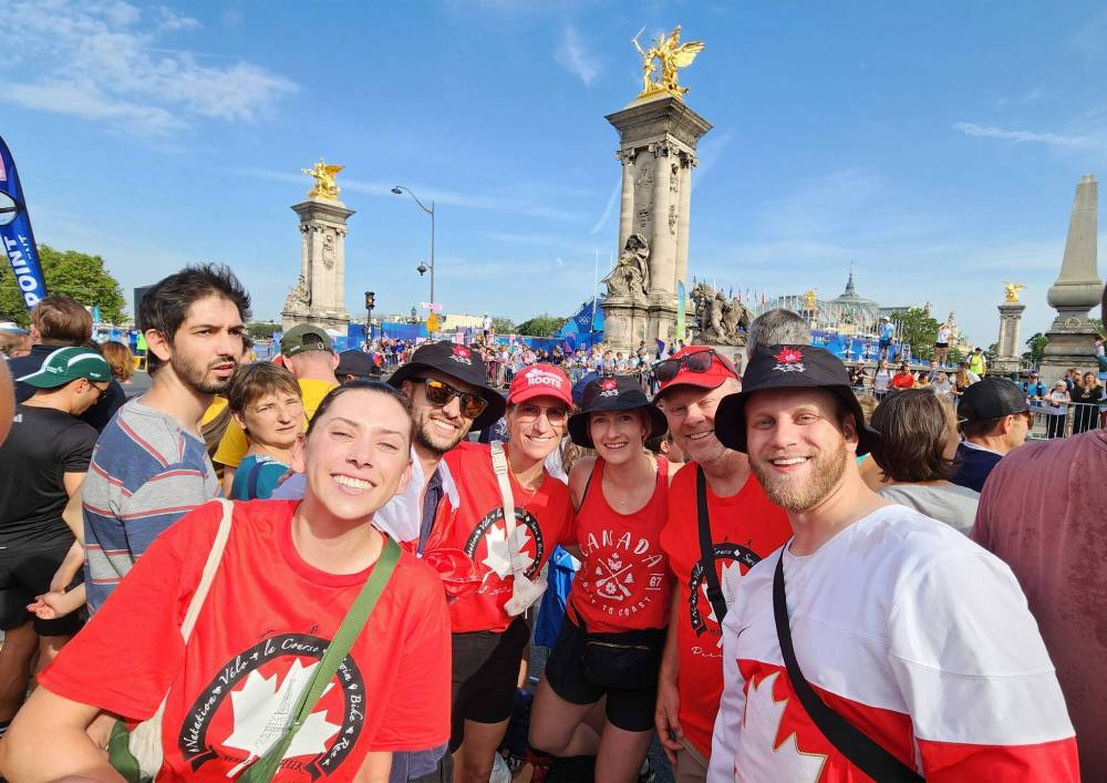 DANIELLE DA SILVA / FREE PRESS
From left: Madison Mislawchuk, Andrew Proven, Tiffany Sheldon, Janna Stefanson, Craig Sheldon, and Kiefer Sheldon at the Pont Alexandre III bridge in Paris, France, on Wednesday to cheer on Oak Bluff triathlete and three-time Olympian Tyler Mislawchuk at the Summer Games.