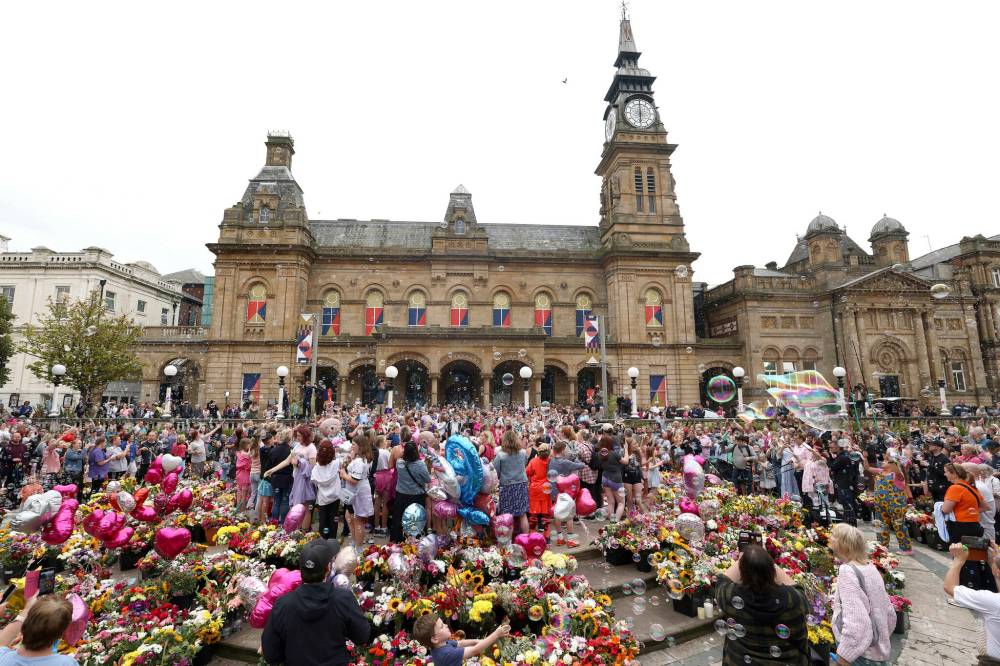 Darren Staples / The Associated Press
A vigil for British stabbing victims