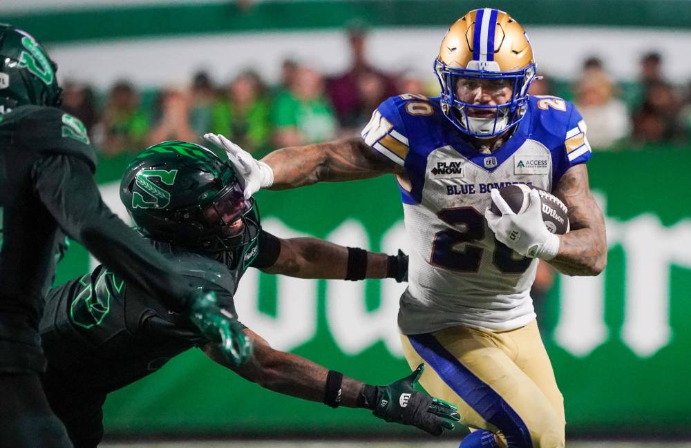 Heywood Yu / THE CANADIAN PRESS files
Blue Bombers running back Brady Oliveira (right) leads CFL in yards from scrimmage heading into the final weekend of the season.