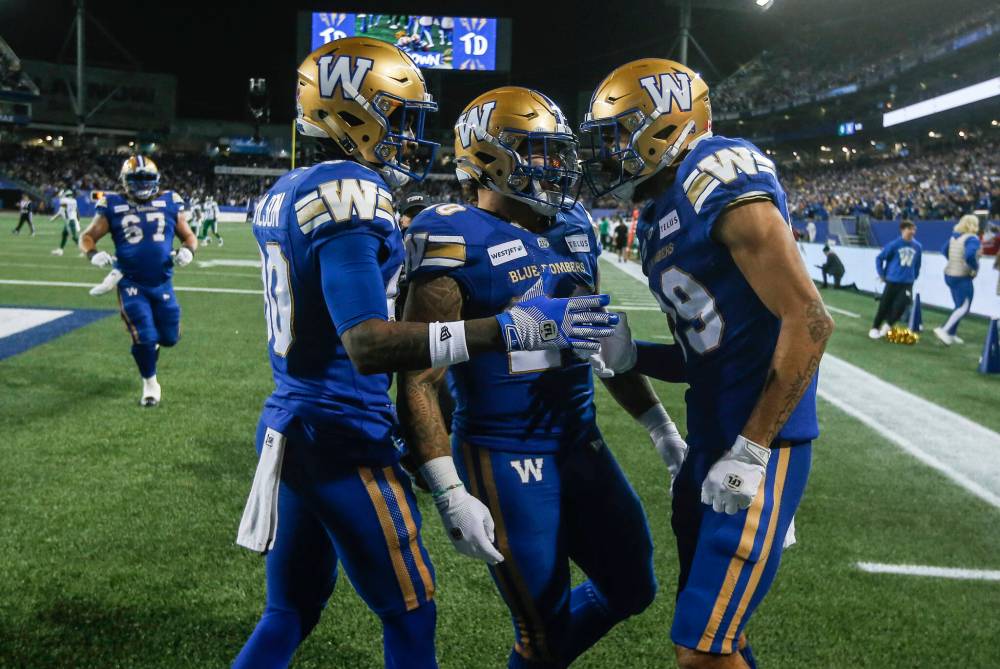 THE CANADIAN PRESS/John Woods
Winnipeg Blue Bombers’ Ontaria Wilson (80), Brady Oliveira (20) and Kenny Lawler (89) celebrate Lawlor’s touchdown against the Saskatchewan Roughriders during the first half of CFL Western Conference Final action in Winnipeg Saturday, November 9, 2024.