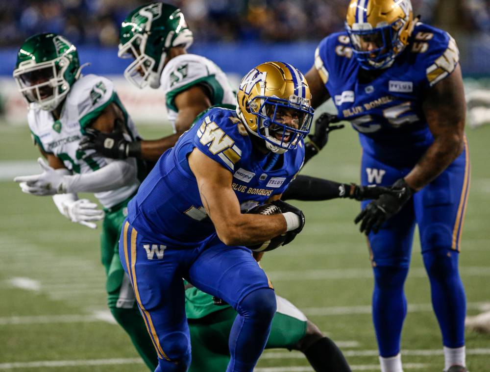 THE CANADIAN PRESS/John Woods
Winnipeg Blue Bombers’ Nic Demski (10) crosses the line for the touchdown against the Saskatchewan Roughriders during the first half of CFL Western Conference Final action in Winnipeg Saturday, November 9, 2024.