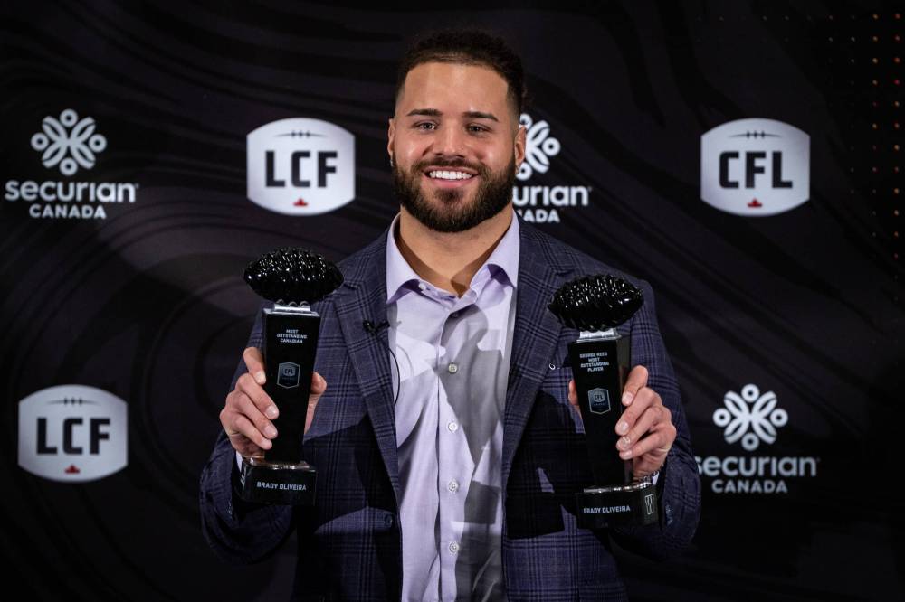 THE CANADIAN PRESS/Ethan Cairns
Winnipeg Blue Bombers’ Brady Oliveira is awarded Most Outstanding Player and Most Outstanding Canadian during the CFL Awards in Vancouver, on Thursday.