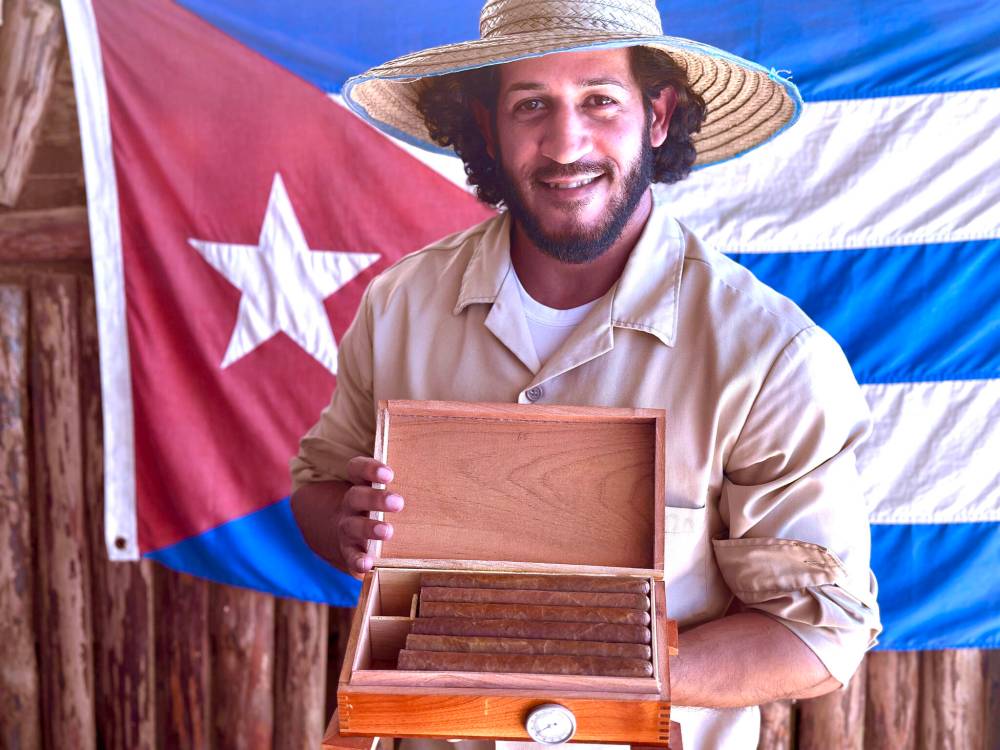 Anier Boffill shows off cigars hand-rolled at his family farm in the Viñales region of Cuba.