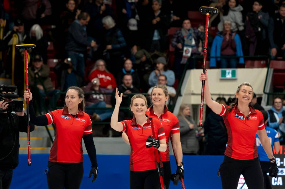 DAVID JACKSON / THE CANADIAN PRESS
Team Canada skip Rachel Homan (from left), Tracy Fleury, Sarah Wilkes and Emma Miskew celebrate after defeating Manitoba in the quarter-finals on Saturday.