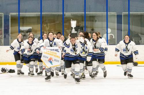 BROOK JONES/FREE PRESS
                                Olympiens captain Cadence Kibbins hoists the Wayne Thompson Cup as she leads her teammates on a celebratory lap of the ice Friday after they captured the Manitoba Women’s High School Hockey League championship.