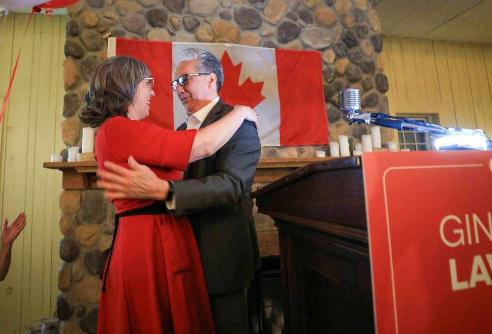 Ruth Bonneville / Free Press
Lavack celebrates her victory with former Liberal cabinet minister Dan Vandal, Monday.