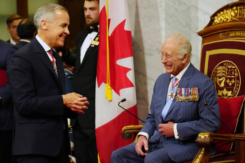 CHRIS YOUNG / THE CANADIAN PRESS
Prime Minister Mark Carney (left) speaks with King Charles ahead of the King delivering the speech from the throne in the Senate in Ottawa on Tuesday.