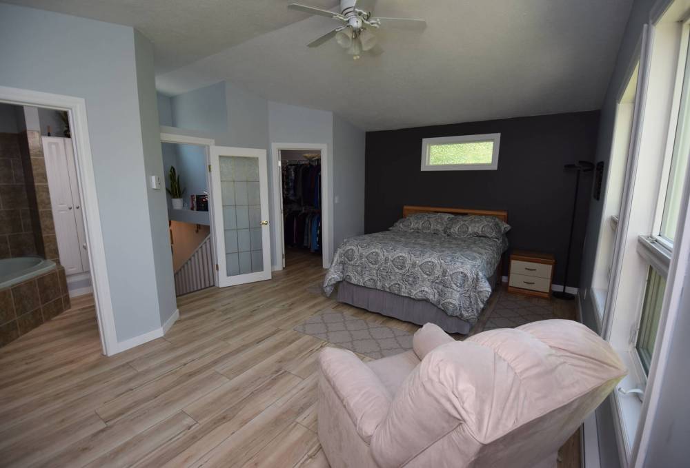 TODD LEWYS / FREE PRESS
The primary bedroom has the whole top floor of the house to itself and is a private oasis of tranquility.
