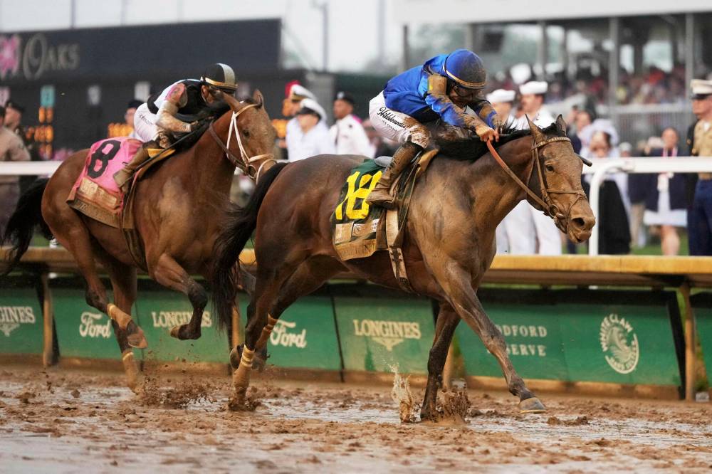 JEFF ROBERSON / THE ASSOCIATED PRESS FILES
Sovereignty crosses the finish line to win the 151st running of the Kentucky Derby early in May this year.