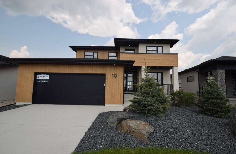 Todd Lewys photos / Free Press
Clad in durable metal woodgrain-style siding, 19 Oasis is a warm, inviting luxury home that’s all about function and elegant, understated style.