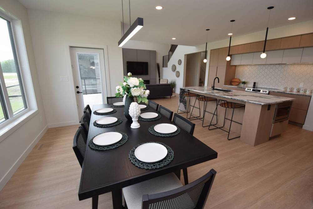 Todd Lewys photos / Free Press
The spacious dining area flows beautifully into the island kitchen and magnificent great room.