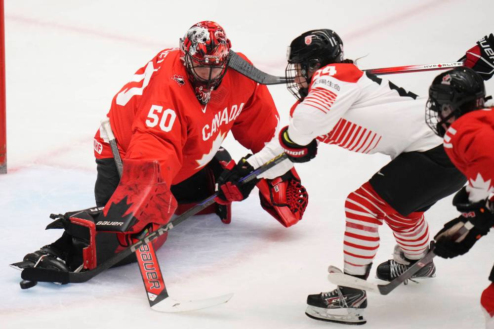 PETR DAVID JOSEK / THE ASSOCIATED PRESS FILES
Kristen Campbell (left) makes a toe save during the quarterfinal game between Canada and Japan at the IIHF women’s world championship in April. The Brandon product won both games she started at the 2025 tournament.