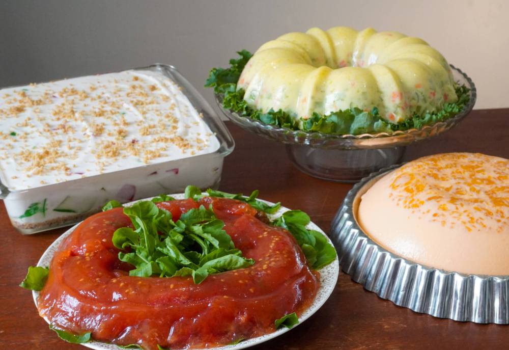 EVA WASNEY / FREE PRESS
Clockwise from top left: Broken glass torte, spring parfait salad, orange jellied salad, tomato aspic.