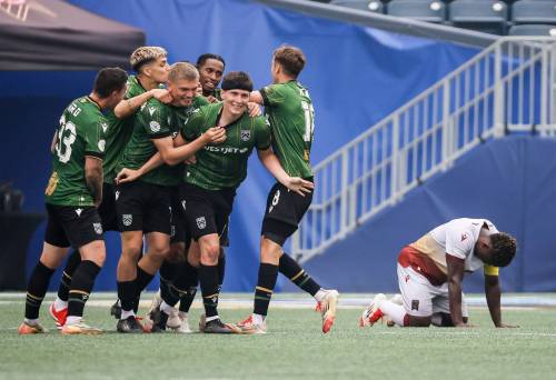 JOHN WOODS / FREE PRESS
                                Calvary FC celebrate Sergio Camargo’s goal against Valour’s Raphael Ohin (right) on Sunday. The loss was Winnipeg’s fifth straight.