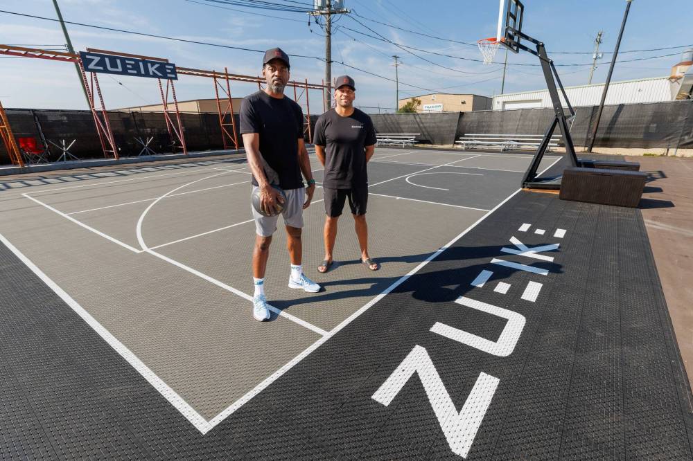 MIKE DEAL / FREE PRESS
Ogo Okwumabua (left) and Bryan Salvador, co-owners of Zueike Inc., an apparel line that specializes in comfortable clothing for athletes, at their new facility at 65 Trottier Bay