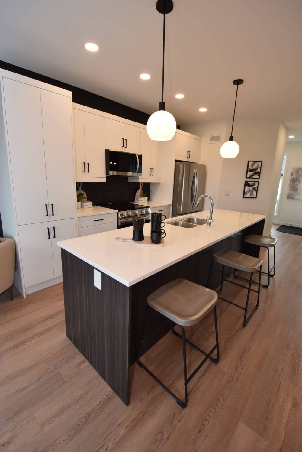 TODD LEWYS / FREE PRESS
The island kitchen at 534 Couture Crescent in RidgeWood West is a perfect mix of utility and panache.