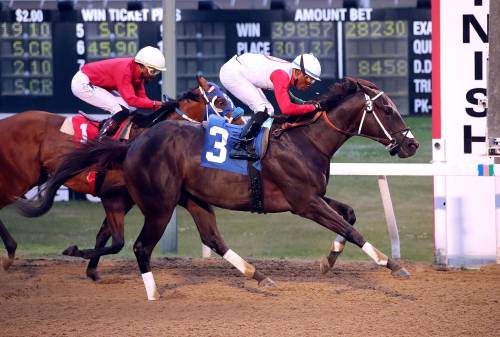 JASON HALSTEAD / ASSINIBOIA PHOTO
                                Rasheed Hughes rides Manitoba Derby favourite Take Charge Tom (3) to victory in the 31st running of the Derby Trial Stakes.
