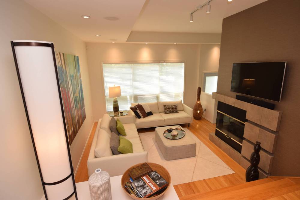 A two-sided fireplace set off by gorgeous tile is the anchor point in the living room.
