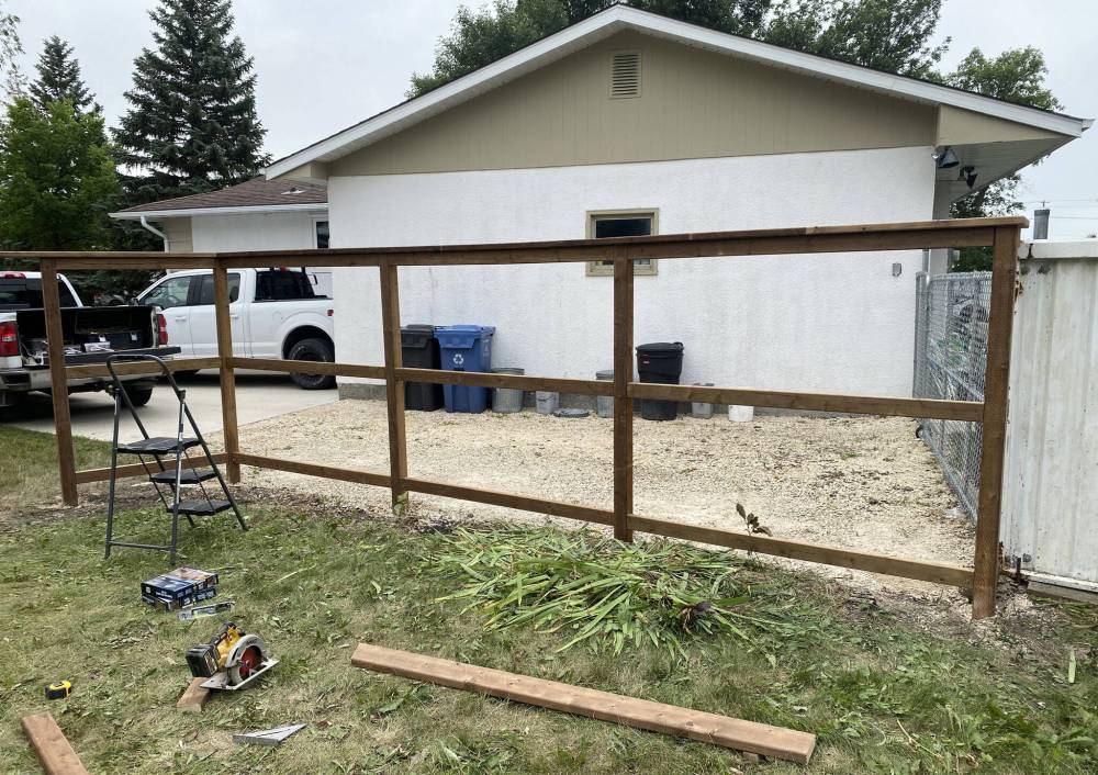 The 10-foot 4 x 4 posts were placed into re-drilled holes, set with quarter down limestone and cut to a height of six feet before the framing began.