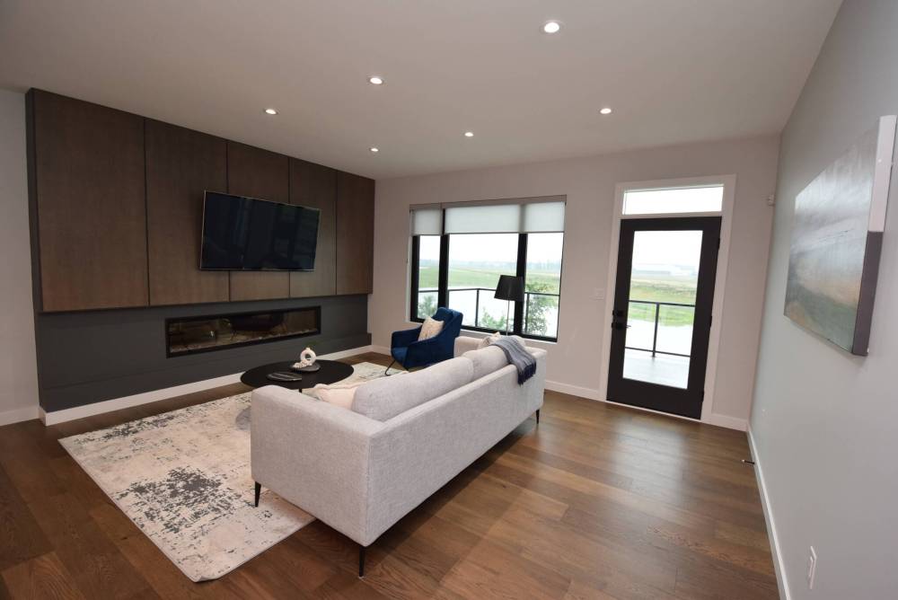 The gorgeous great room hits all the right notes with its style, warmth and amazing water view.