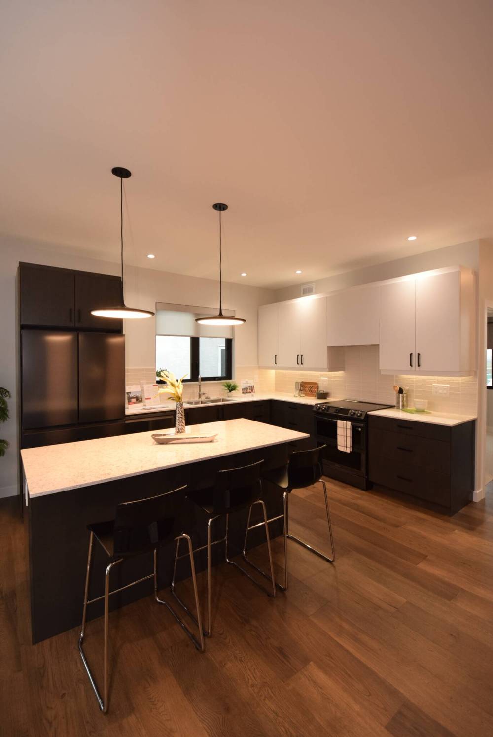 The stunning island kitchen at 27 Oasis Bend in Bison Run is a chef’s dream.