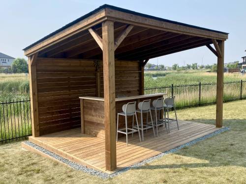 Marc LaBossiere photos / Free Press
                                This covered ground-level deck boasts a custom two-tiered bar.