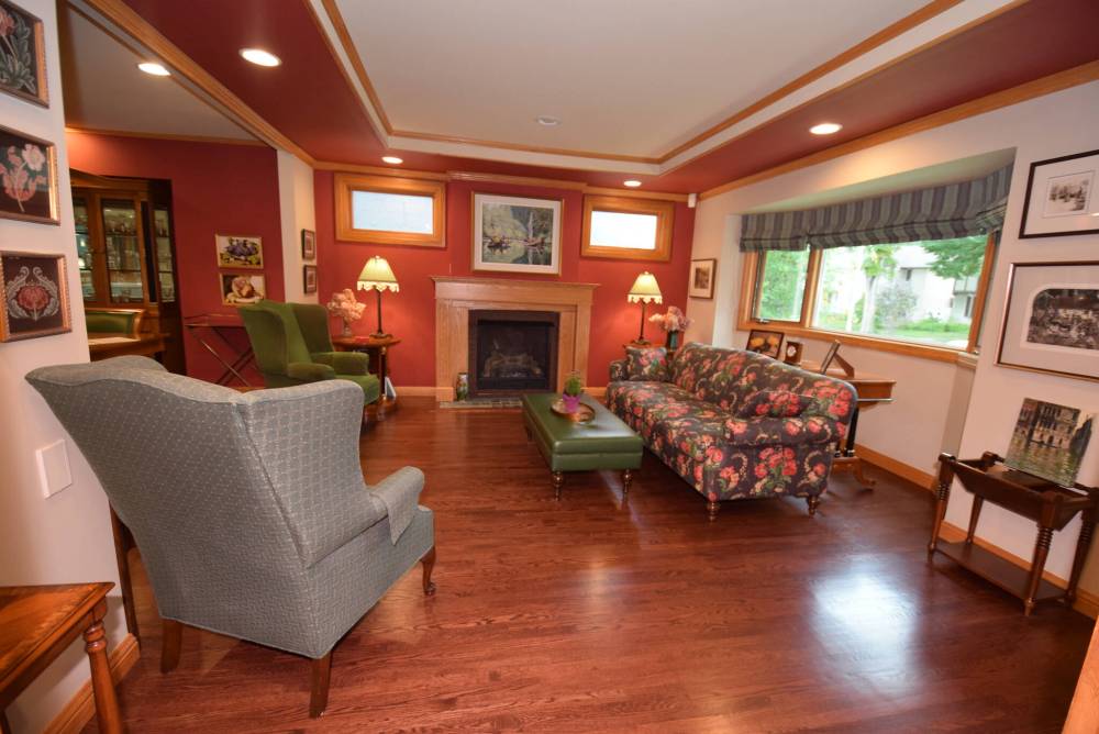 A splendid tray ceiling and gas fireplace are among the highlights of this sophisticated living room.