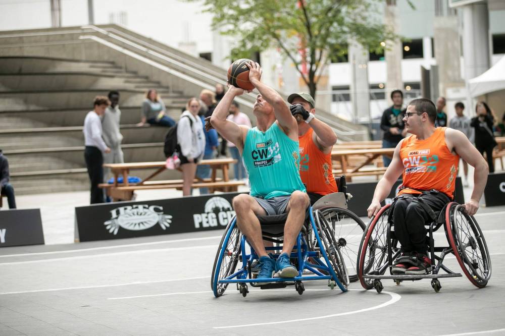 BROOK JONES/FREE PRESS
Bryce McDonald launches a shot during a game of 3x3 wheelchair hoops.