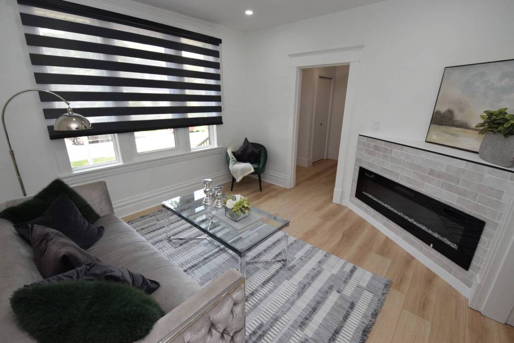 Todd Lewys photos / Free Press
Modern style meets classic character in the bright living room, which is anchored by a linear electric fireplace.