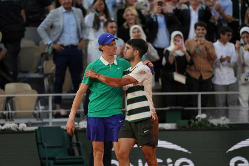 Thibault Camus / Associated Press files
                                In this June 2025 photo, Carlos Alcaraz (right) hugs Jannik Sinner after defeating him in the French Open final. Sinner would return the favour in July at Wimbledon.