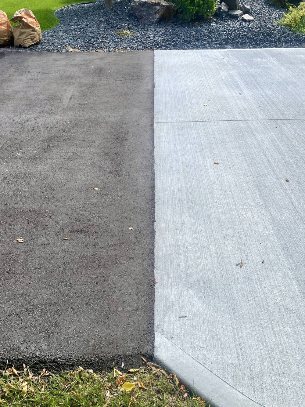 There’s now a clean line between the dark asphalt and light concrete.
