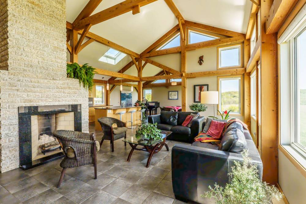 Timber frame supports and beams combine with a vaulted ceiling to create a welcoming, lodge-like feel.