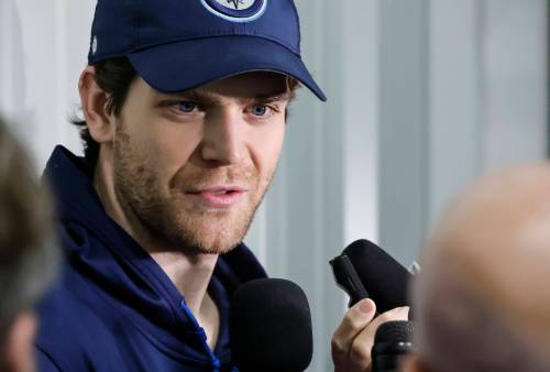 John Woods / THE CANADIAN PRESS
                                Winnipeg Jets captain Adam Lowry expects to return to the club’s lineup at the ‘end of October, start of November.’
