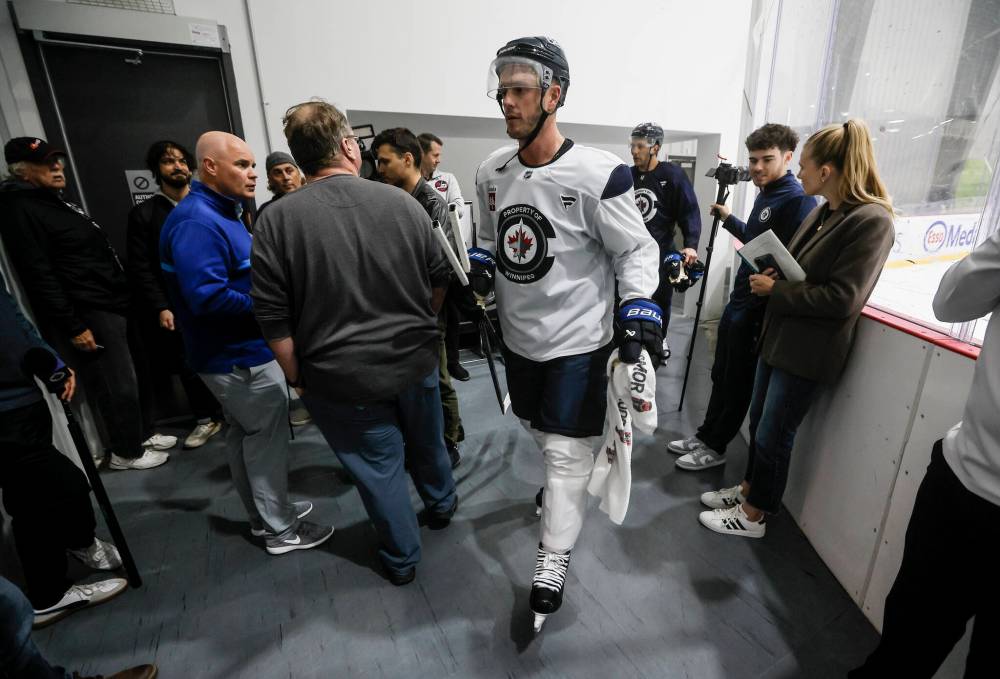 John Woods / The Canadian Press
Winnipeg Jets’ Jonathan Toews walks past media after a pre-training camp practice in Winnipeg on Thursday.