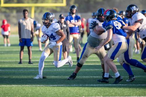 BROOK JONES/FREE PRESS FILES
                                Winnipeg Rifles running back Kaiden Banfield carries the football during the team’s practice at Maple Grove Rugby Park in Winnipeg.