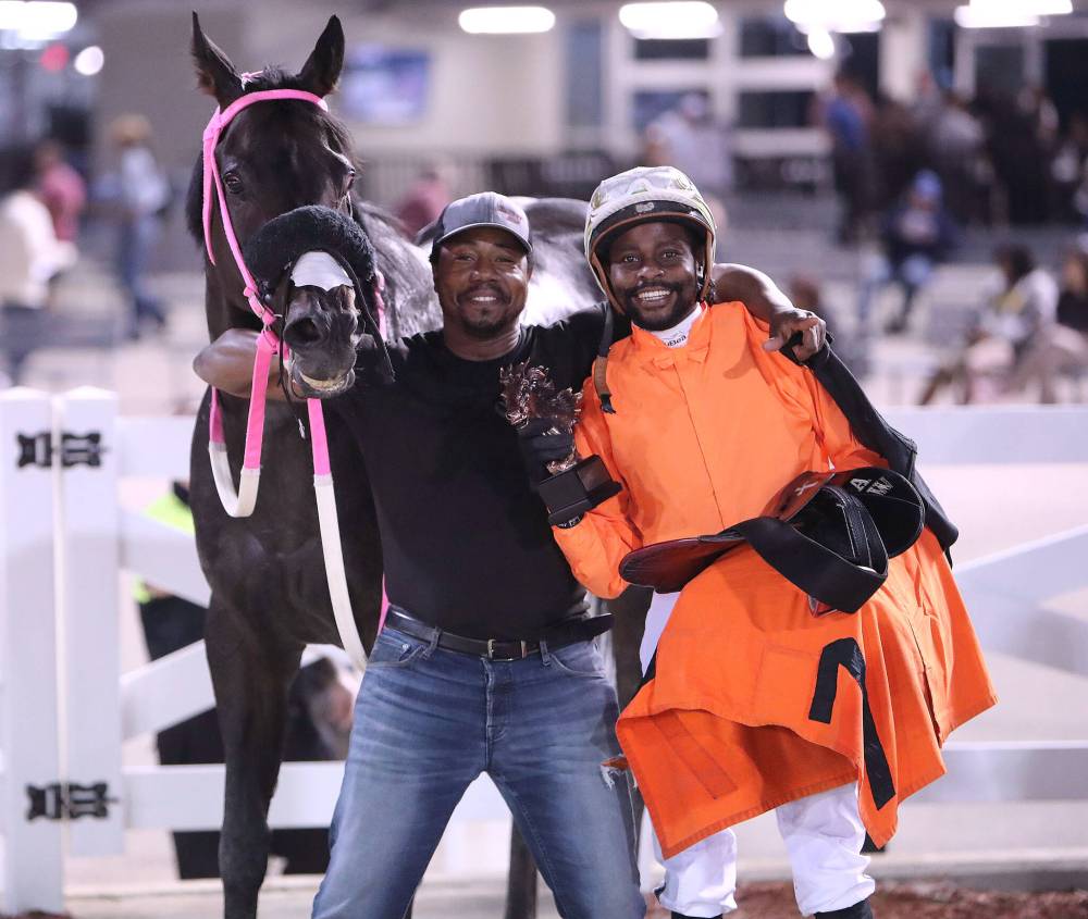 Jason Halstead / Assiniboia Photo
Groom Kenroy “Cuba” Rowe and jockey Antonio Whitehall with Mechanic Susie after their win in the Distaff Stakes.