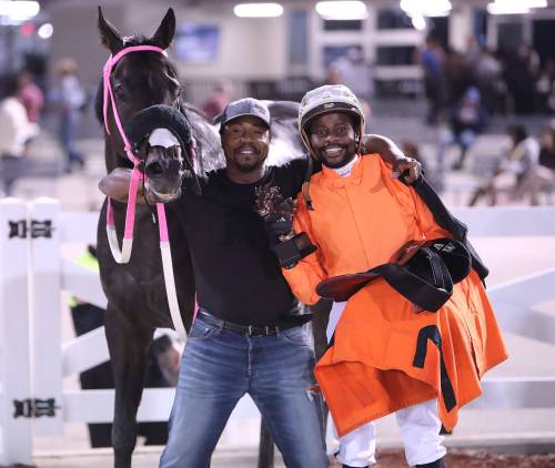 Jason Halstead / Assiniboia Photo
                                Groom Kenroy “Cuba” Rowe and jockey Antonio Whitehall with Mechanic Susie after their win in the Distaff Stakes.