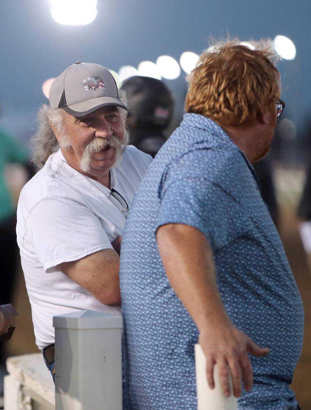 Jason Halstead / Assiniboia Photo
Trainer Dewey Williams smiling at assistant Eugene Burns after winning the Orisis Stakes.