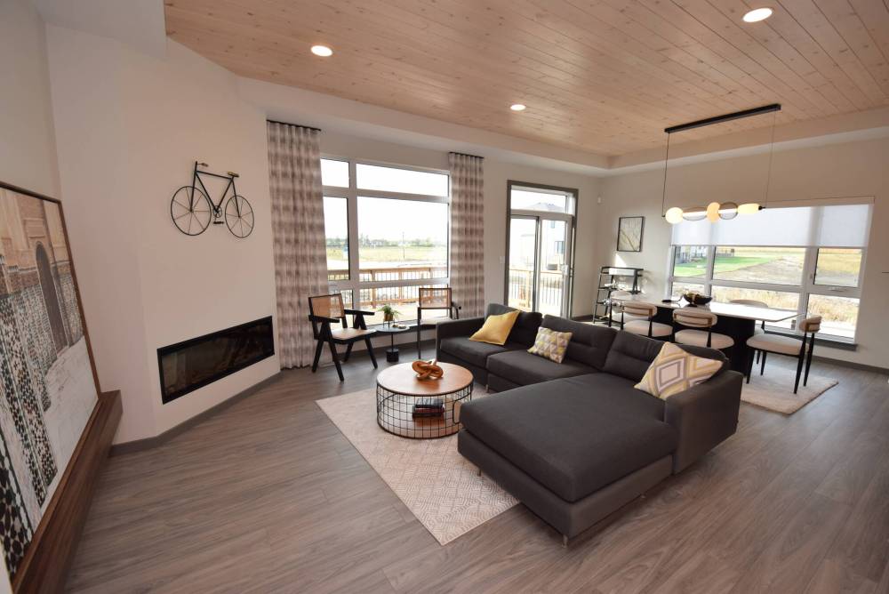 The great room and dining room are filled with natural light.
