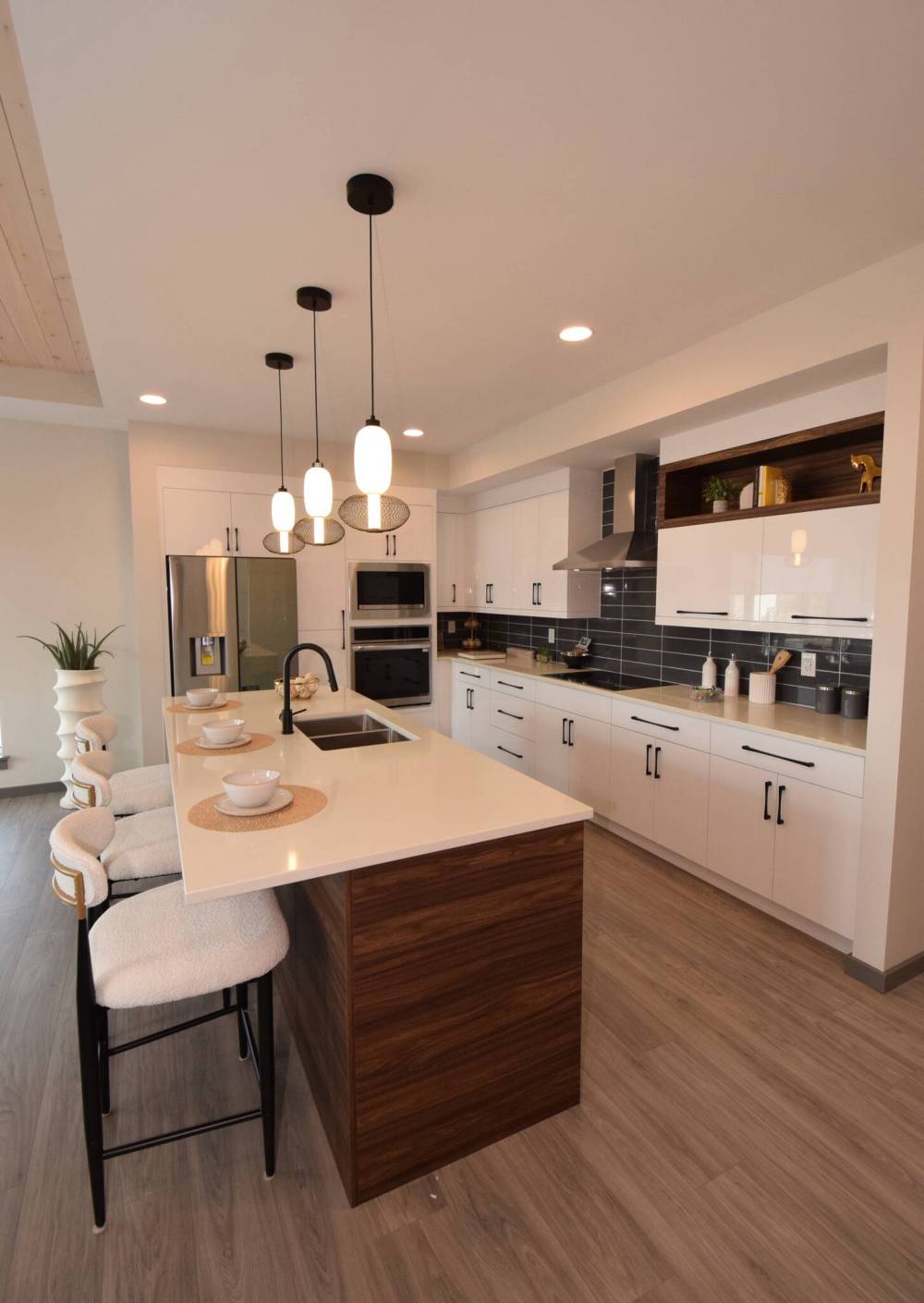 Todd Lewys photos / Free Press
The gleaming island kitchen at 94 Butterfly Way in Sage Creek will have you cooking in style.