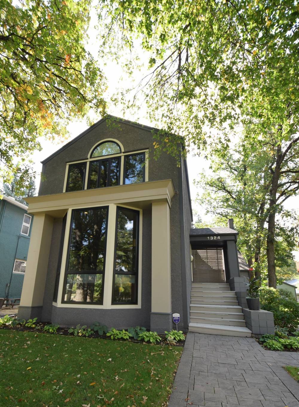 The masterfully designed home, with its large windows framing views of the mature trees, is beautiful inside and out.