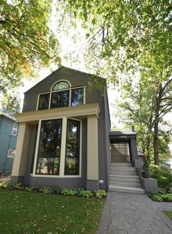 The masterfully designed home, with its large windows framing views of the mature trees, is beautiful inside and out.