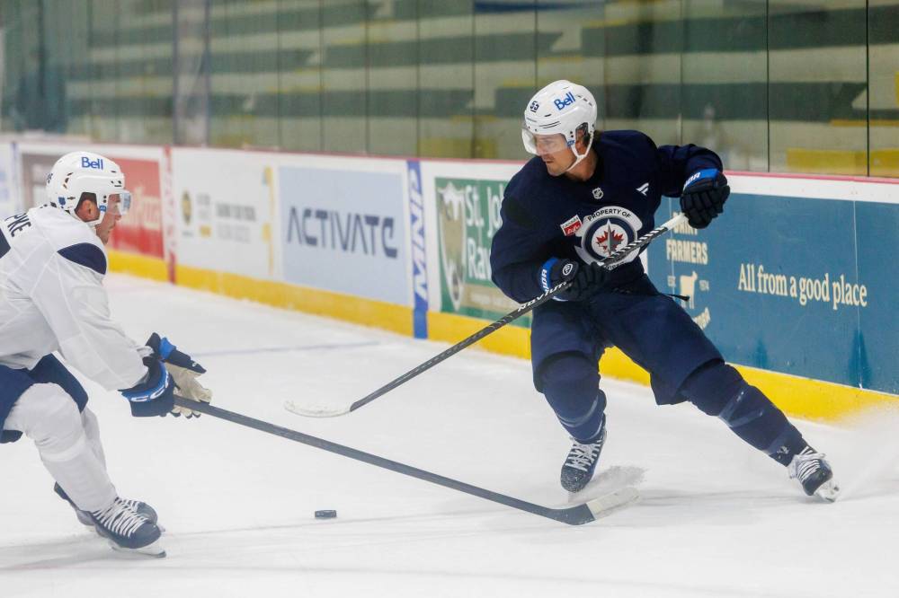 MIKE DEAL / FREE PRESS
Winnipeg Jets centre Mark Scheifele (right) said Thursday he’s “very, very excited” the fitness test will no longer be part of training camp anymore.