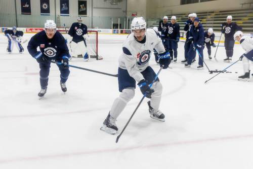 MIKE DEAL / FREE PRESS
                                Part of Winnipeg Jets defenceman Dylan DeMelo’s (centre) plans for this season is for him and his linemate, Josh Morrissey, to be the best pair in the league.