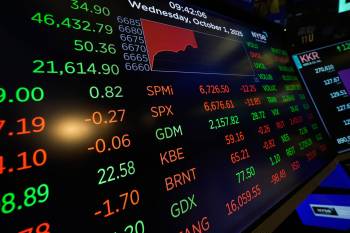 Seth Wenig / The Associated Press
                                Financial information is displayed at the New York Stock Exchange in New York on Wednesday.